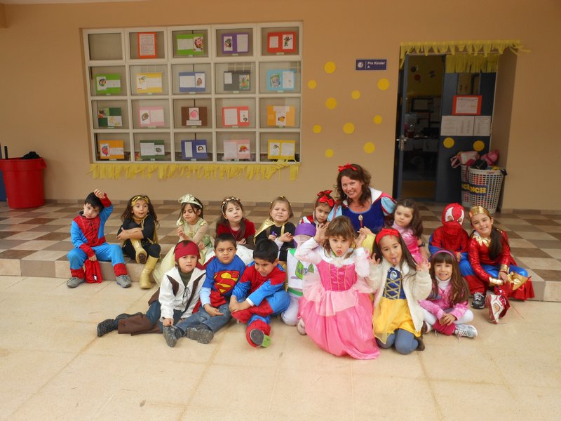 My class in front of our classroom on superhero/princess day
