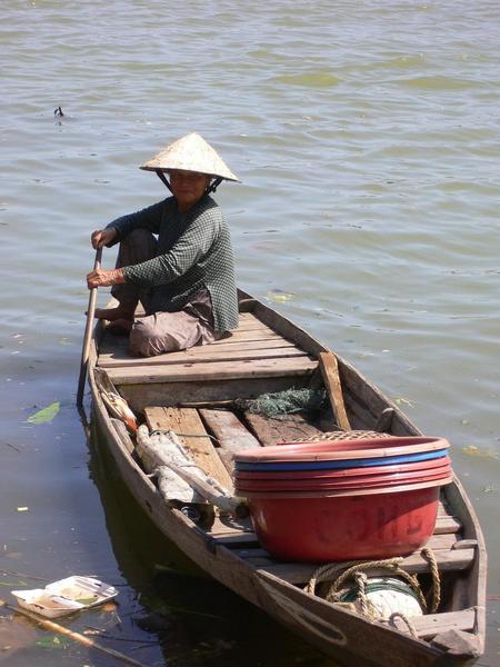 A local woman coming into the market by boat
