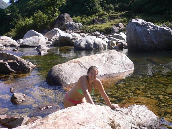 Alex taking a dip in the freezing cold river