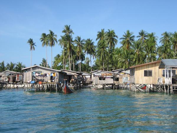 Local houses on stilts at nearby Mabul Island