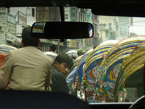 a rickshaw-wallah looking at us!