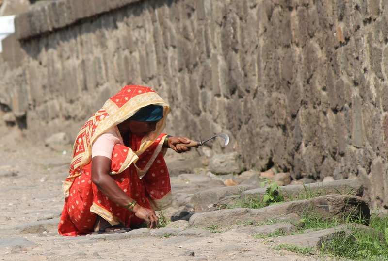 woman working at Daulatabad Fort