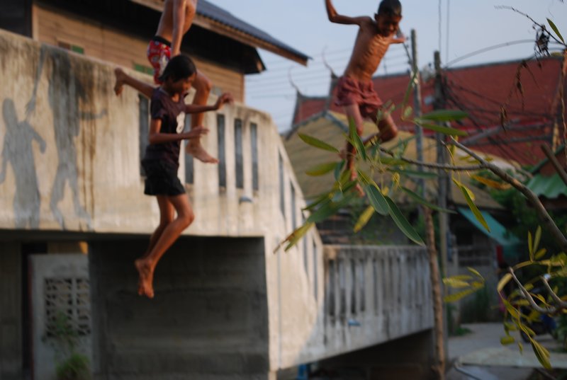 Skinny kids playing on the bridge