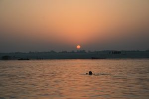 swimming in the Ganga at sunrise