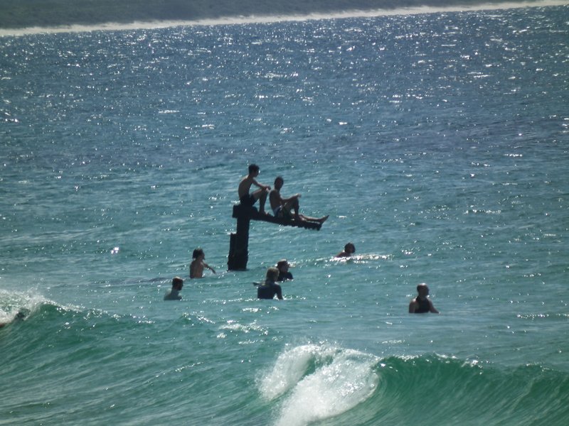 people in the sea at Byron Bay