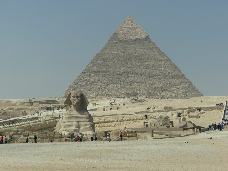 The Sphinx and the giant pyramid in the background