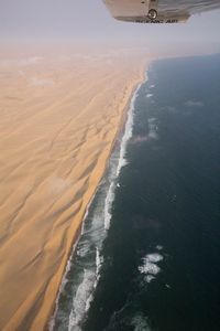 Sand walls meeting the ocean