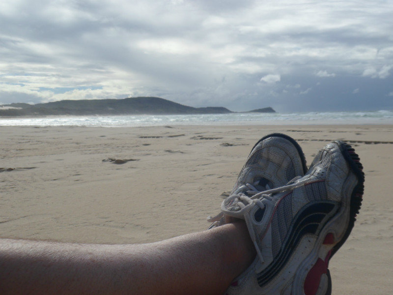 tess feet on beach