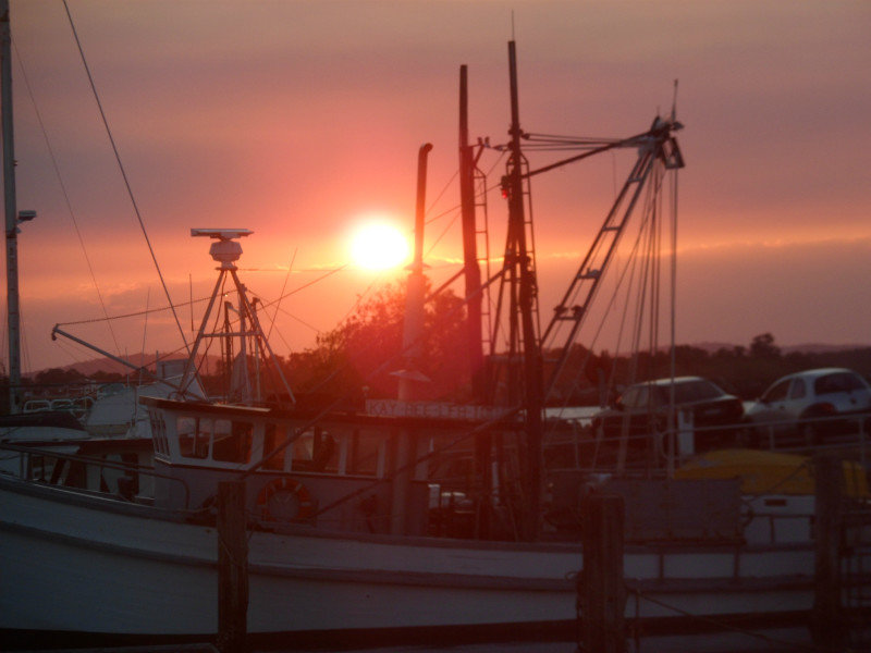 sunset over fishing boats Iluka
