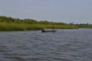 River Trip Dugout canoe and local woman