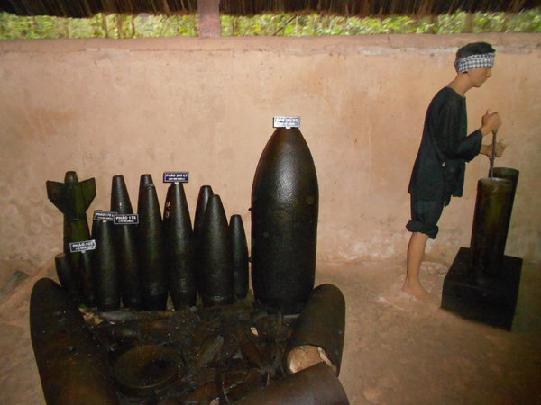 Locals removing explosives from unexploded US bombs - Dangerous job