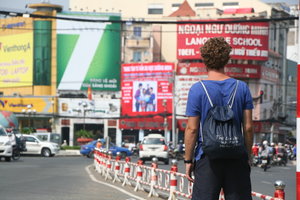 Adam walking around Saigon with all his luggage