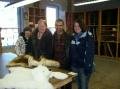 John, Mom, me, and Will at Amana Villages (building of woven goods)