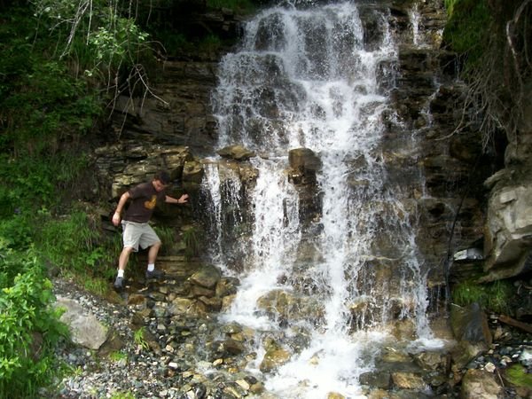 Luke (one of the other counselors) having fun by the waterfall