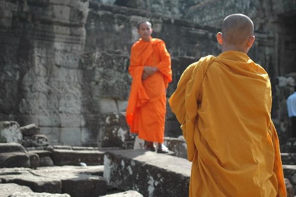 monks wondering the grounds taking pictures of there own