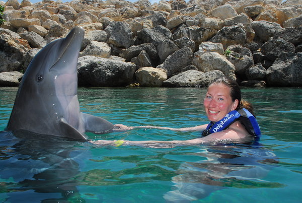 Me holding fins with Dolphin