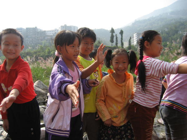 Local children greeting us on the banks of the river
