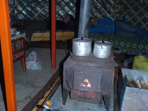 Our woodburner stove used to keep warm, for cooking and to heat water