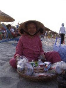 Little old lady selling stuff on the beach