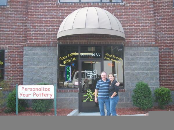 The owners outside their emporium