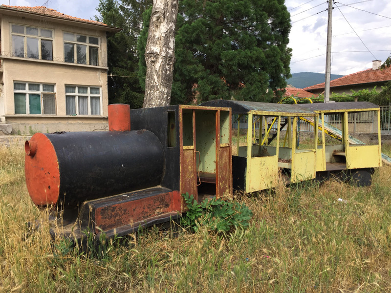 Rusty train in derelict playground, Stobs, Bulgaria.