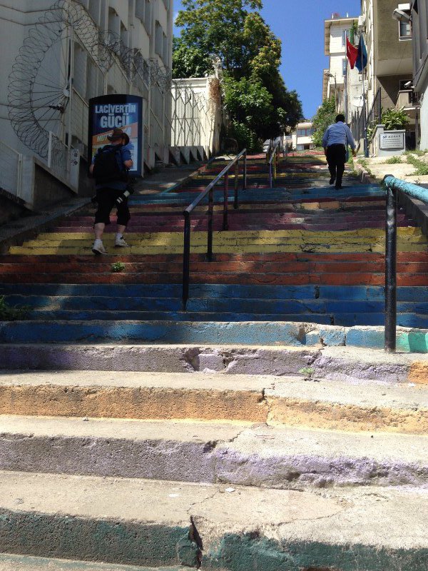 Multi coloured steps go up and up and up.