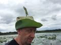 Hubby donning hat made from a lotus leaf.