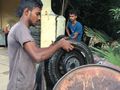 Looking for puncture in car tyre