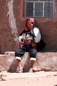 Taquile islander minding his own knitting