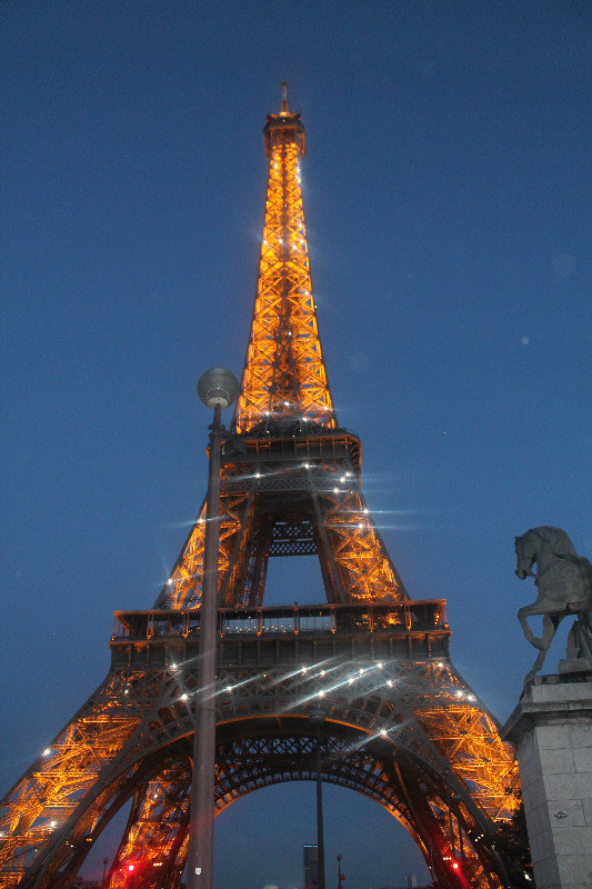 Eiffel tower lighting up the night