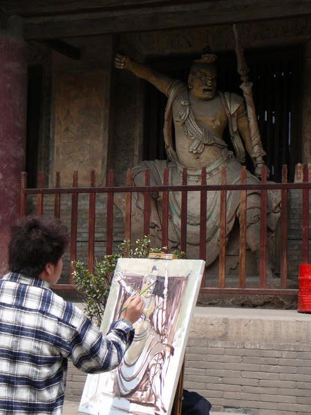 Student artist sketches a statue