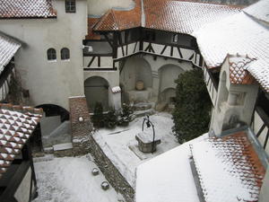 Snow-covered roofs, looking down on the Bran Castle courtyard