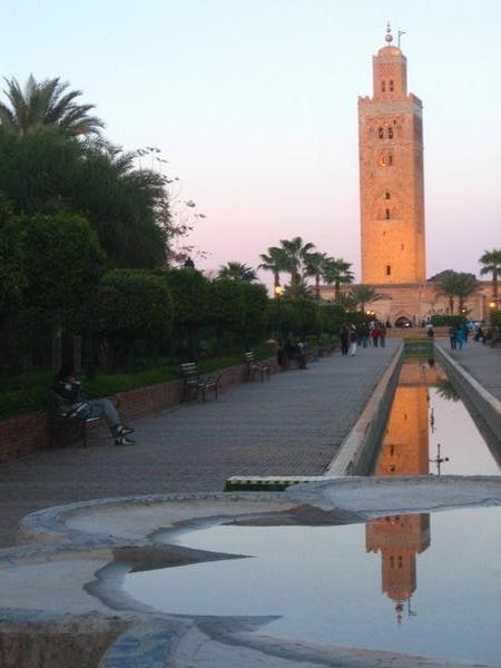 Reflection of The Koutoubia in a fountain in the gardens nearby