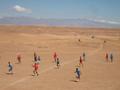 The dry desert conditions do not dampen the spirits of Moroccan soccer players!