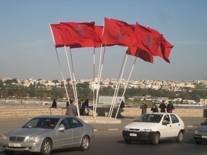 Moroccan flags, looking across the river to the city of Sale