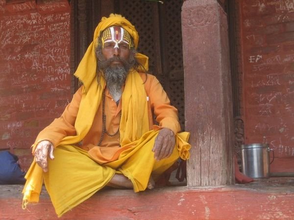 A Sahdu on the steps of a temple in Durbar Square