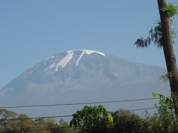 My first glimpse of Kili from the hotel grounds