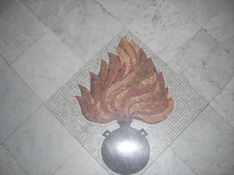 The emblem of the Bomb tiled into the floor at the entrance.