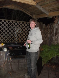 Dave cooking burgers on the Barbie