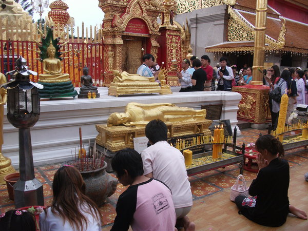 People Praying to Buddha