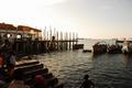 Kids jumping in the water at sunset · Harbor in Stone Town, Zanzibar