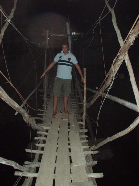 Crossing a dodgy bridge in pitch black to the pub in Vang Vieng