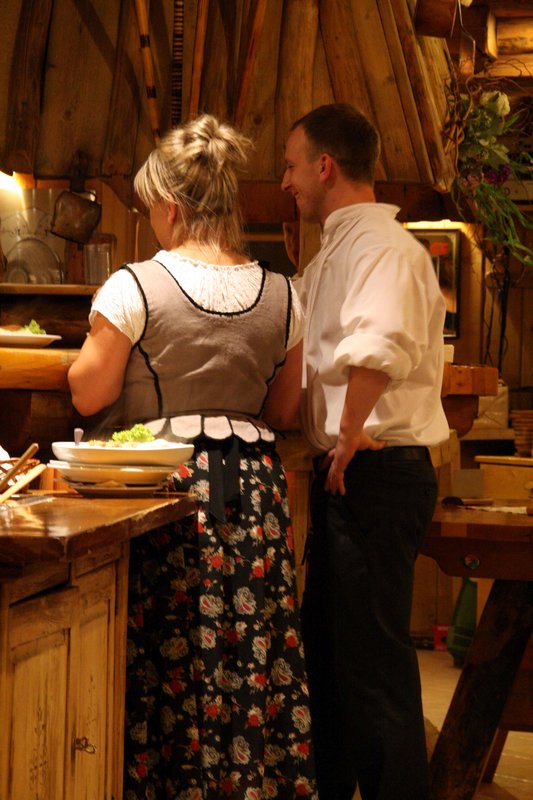 waiters in typical folk clothes