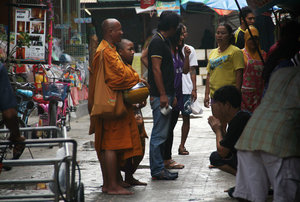 collecting alms on Koh Phi Phi