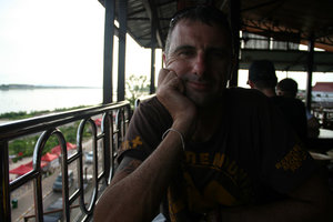having a bite overlooking the Mekong