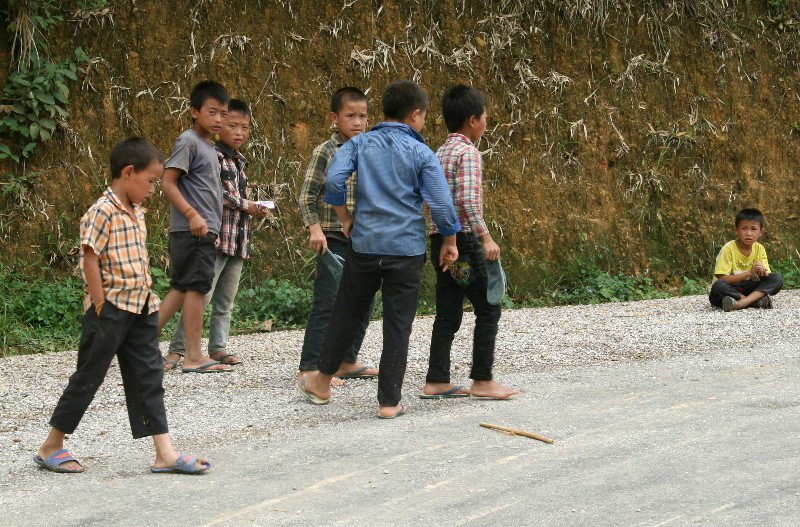 local boys playing a game of flip-flops...