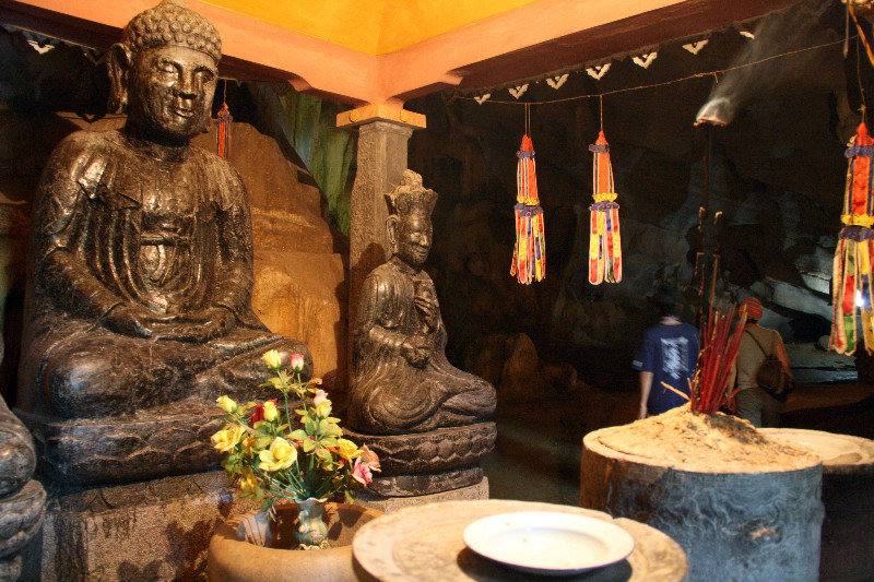 a shrine inside the cave at Bich Dong temple