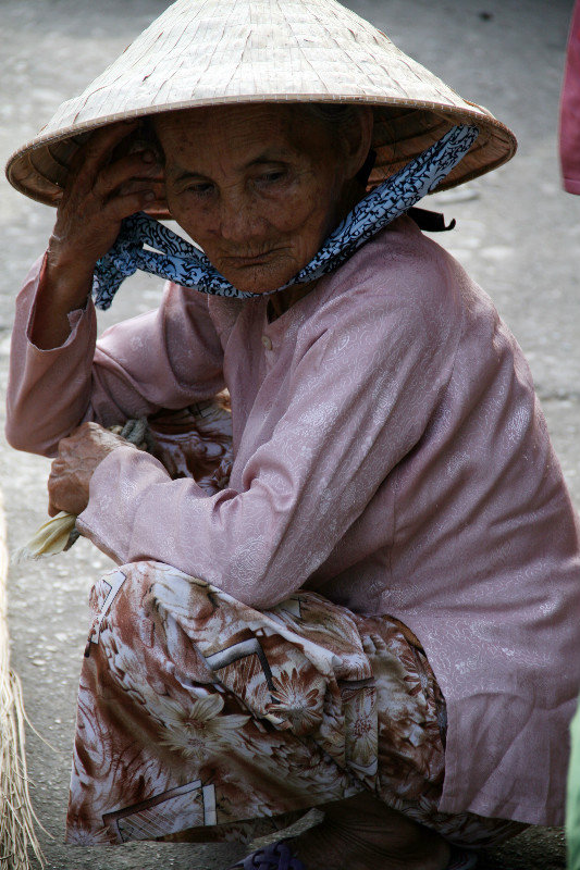 one of many local sellers at the market in Hoi An
