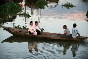 young couple enjoying a boat ride on the river...