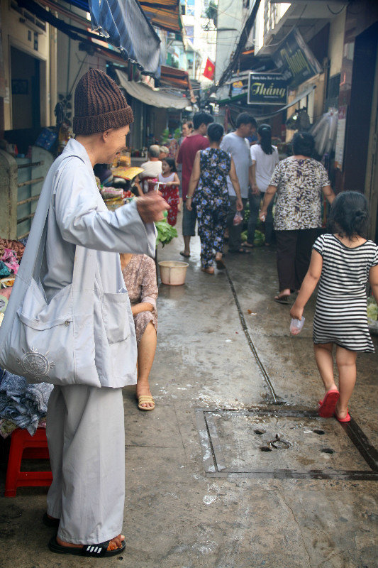 walking through narrow streets of Saigon